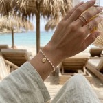 Pulseira pérolas búzio 
